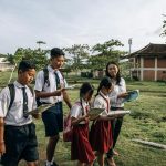 a group of students reading books