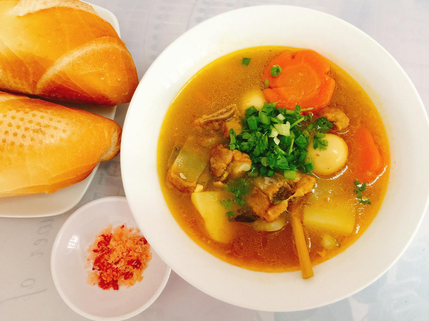 soup in a bowl and bread