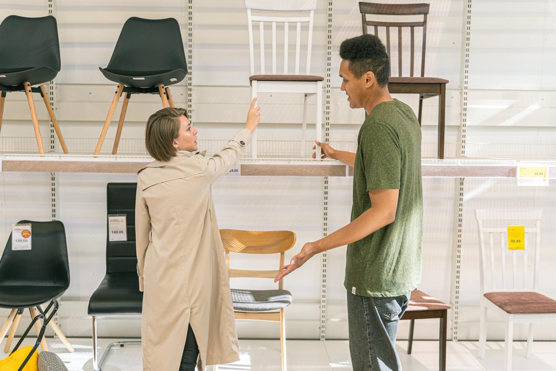 man and woman in furniture shop