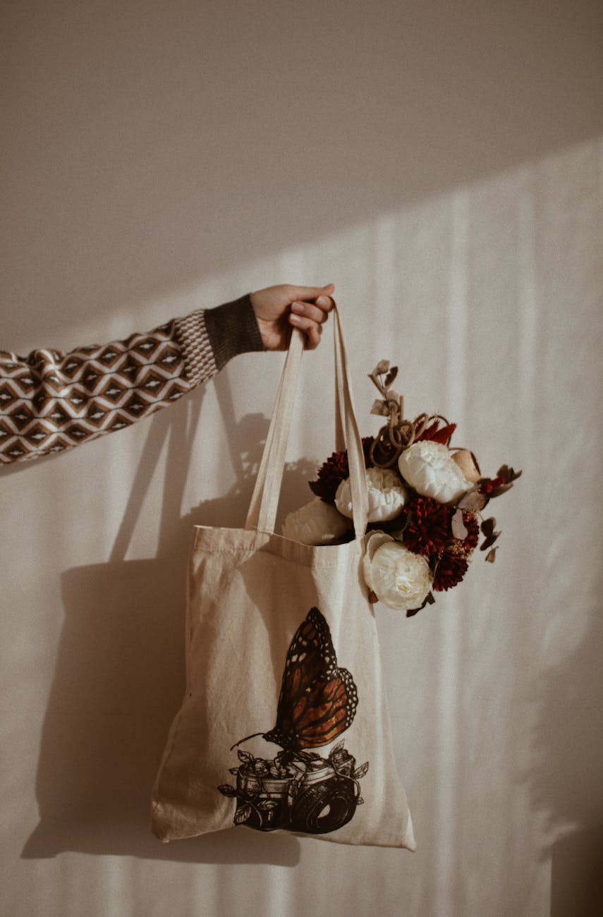 hand holding a shopping bag