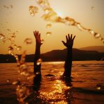 hands above water
