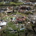aerial view of hurricane destruction in urban area