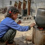 ethnic girl sitting near furnace