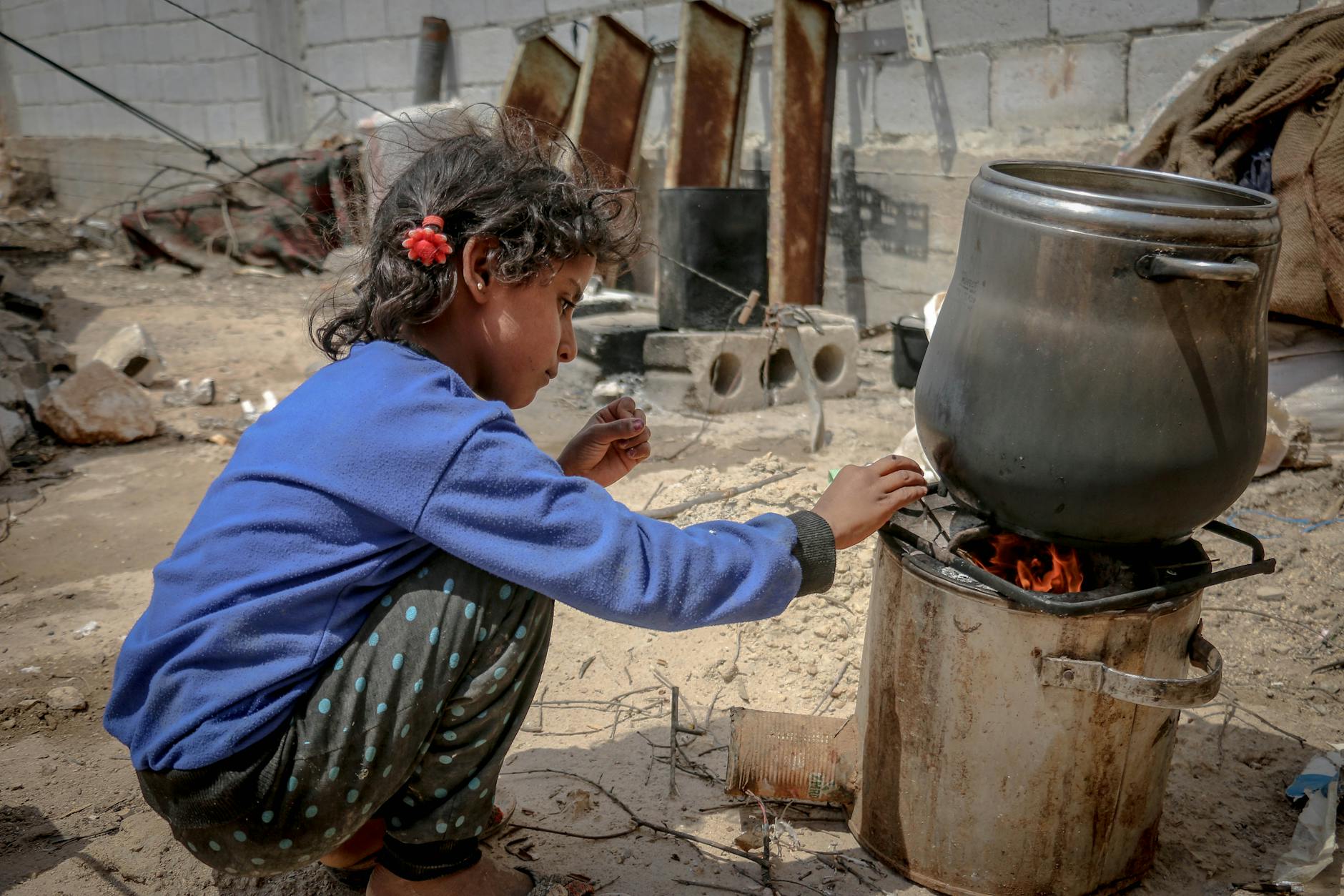 ethnic girl sitting near furnace