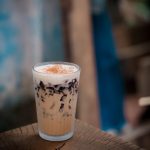 refreshing iced coffee with jelly cubes on table