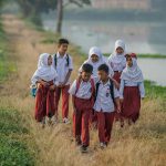 indonesian school children walking after class
