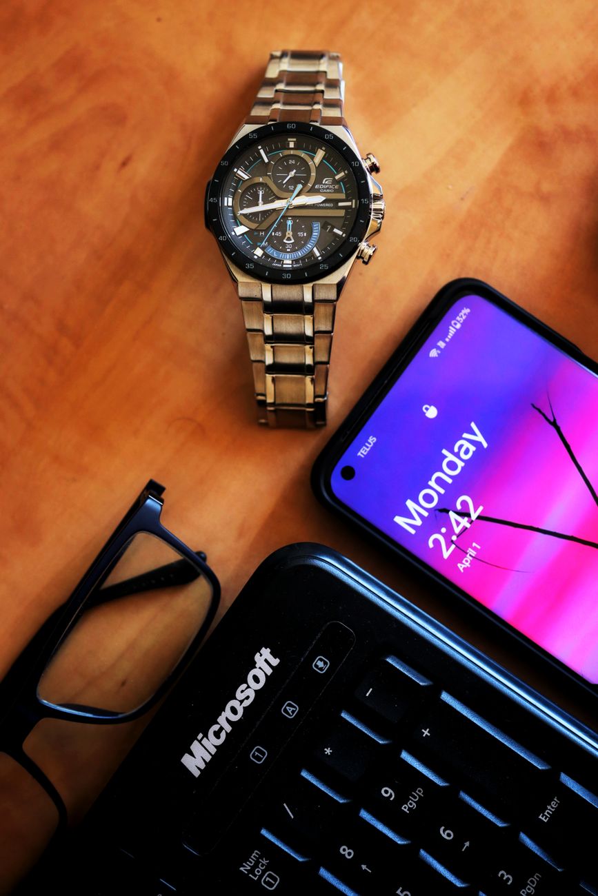 wristwatch smartphone keyboard and eyeglasse