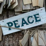 wooden board with script peace