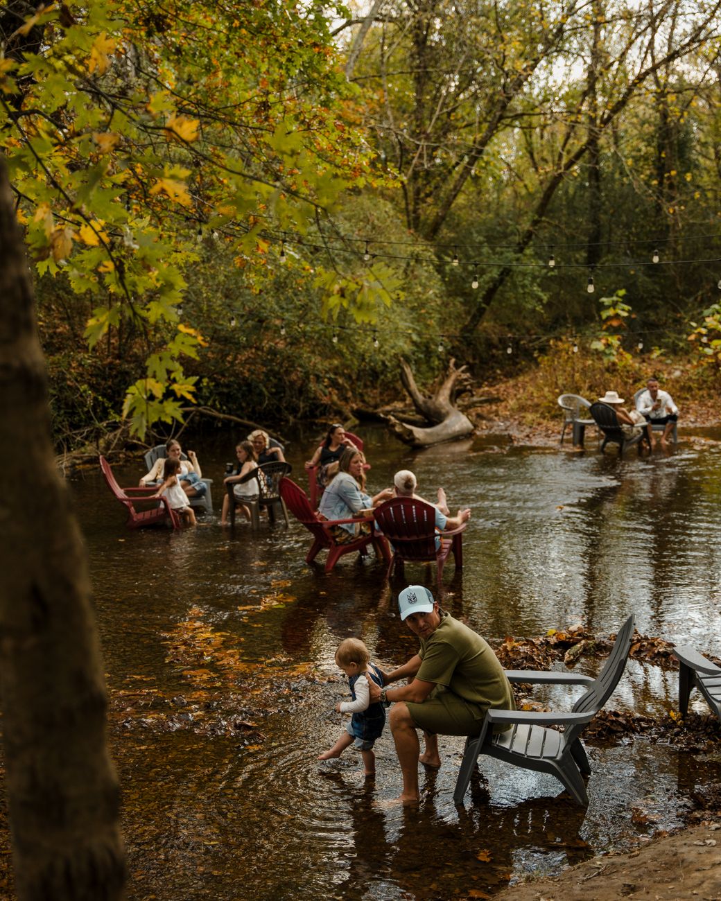 families enjoying a relaxing day by the riverside