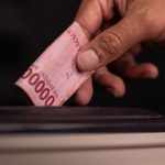 indonesian rupiah donation in charity box