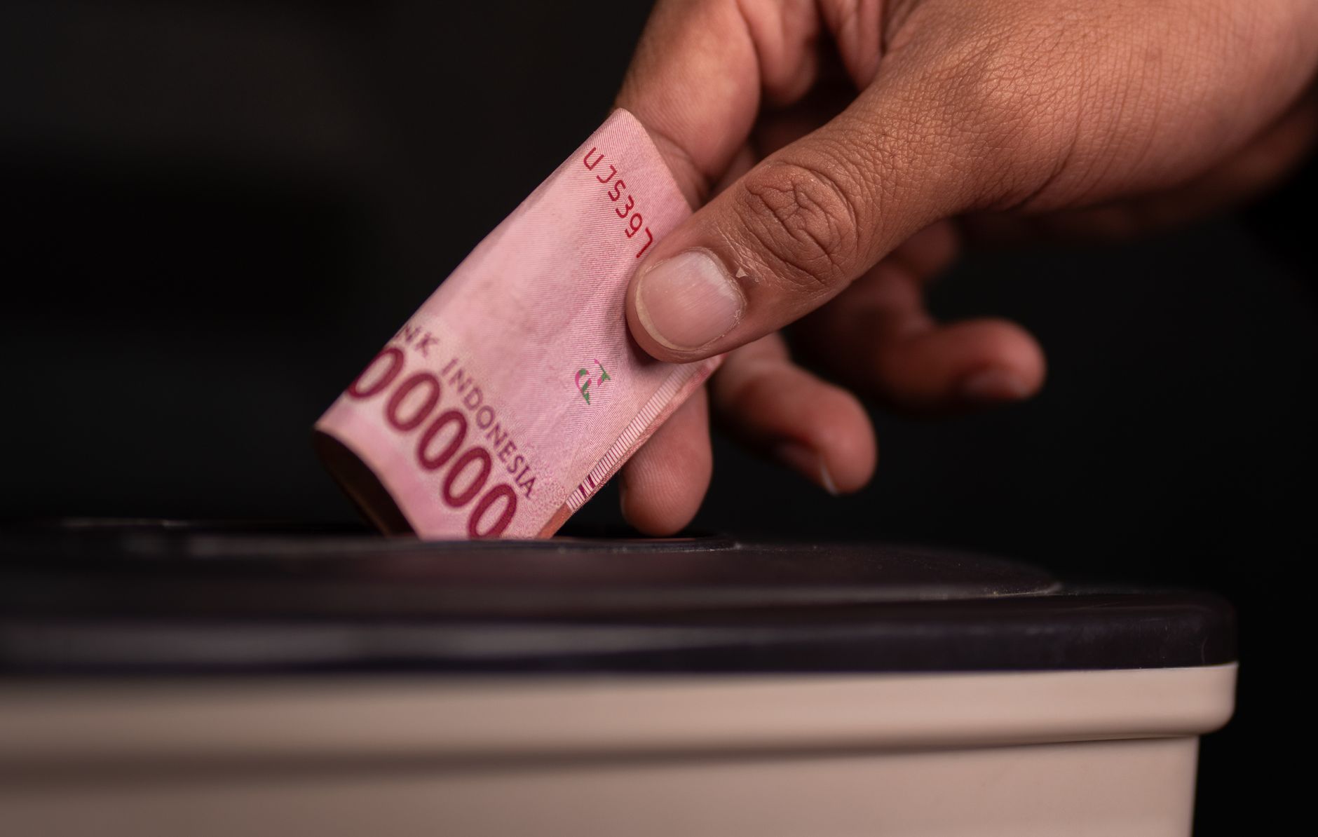 indonesian rupiah donation in charity box