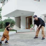 a boy running towards his father