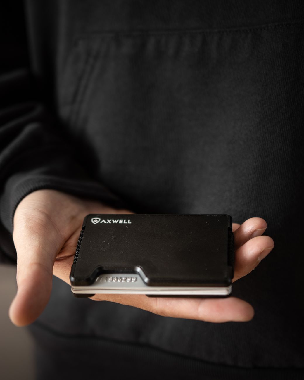 hand holding wallet with cards