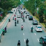 motorbikes and cars on a street